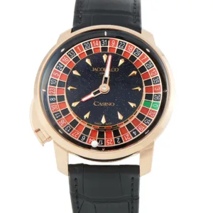 The Jacob & Co. Casino Tourbillon CA100.40.AA.AC.ABALA is an extraordinary luxury timepiece that combines high horology with the theatrical world of roulette. Designed as part of Jacob & Co.’s Casino collection, this distinctive watch replaces a conventional dial experience with a mechanical roulette wheel that becomes the visual and functional centerpiece of the timepiece. Jacob & Co. Casino Tourbillon CA100.40.AA.AC.ABALA Housed in a 47mm 18K rose gold case, the Jacob & Co. Casino Tourbillon presents a bold wrist presence characteristic of the brand. The black dial architecture provides a dramatic background for the roulette mechanism, while the rose gold case and matching rose gold components create a luxurious contrast. The defining feature of the Jacob & Co. Casino Tourbillon is its working miniature roulette wheel. Red and black numbered pockets rotate around the central mechanism, creating an animated display inspired directly by the game of roulette. The mechanical construction transforms the watch from a traditional timekeeping instrument into an intricate piece of kinetic horology. Hours and minutes are displayed through a separate indication positioned within the roulette mechanism, allowing the watch to retain practical timekeeping functionality while emphasizing its elaborate mechanical character. Rose Gold Case and Distinctive Design The 18K rose gold case gives the CA100.40.AA.AC.ABALA its unmistakable luxury-watch appearance. Measuring 47mm, the case is substantial and designed for collectors who appreciate highly distinctive complications and unconventional watchmaking. The transparent caseback provides a view of the automatic movement and the mechanical architecture supporting the watch's unusual display. The black aesthetic continues through the strap, creating a cohesive combination of rose gold, black and the colorful roulette mechanism. Automatic JCAA51 Movement Powering the watch is the JCAA51 automatic movement, engineered to operate the Casino's timekeeping functions and mechanical display. The movement provides approximately 48 hours of power reserve and can be viewed through the transparent caseback. The combination of automatic winding and an elaborate mechanical complication makes the Casino Tourbillon an example of Jacob & Co.'s approach to contemporary haute horlogerie, where technical construction and visual spectacle are equally important. Black Alligator Strap The watch is fitted with a black alligator leather strap paired with a rose gold deployant clasp. The dark strap complements the black dial while allowing the 18K rose gold case to remain the dominant visual element on the wrist. With 30 meters of water resistance, the Jacob & Co. Casino Tourbillon is designed primarily as a sophisticated luxury and collectible timepiece rather than a sports or diving watch. A Statement Jacob & Co. Timepiece The Jacob & Co. Casino Tourbillon CA100.40.AA.AC.ABALA is particularly suited to collectors seeking a watch that goes beyond conventional complications. Its roulette-inspired mechanism, large rose gold case and automatic JCAA51 movement give it a highly distinctive identity within the luxury watch market. For collectors interested in unconventional haute horlogerie, the Casino Tourbillon represents Jacob & Co.'s signature combination of mechanical creativity, precious materials and theatrical design.